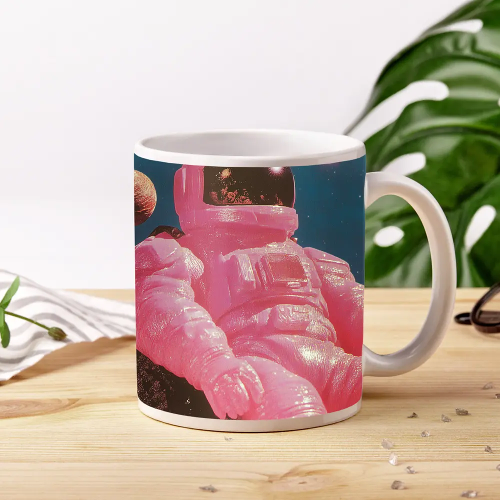 Pink Astronaut Sitting On Moon Surface – Mugs