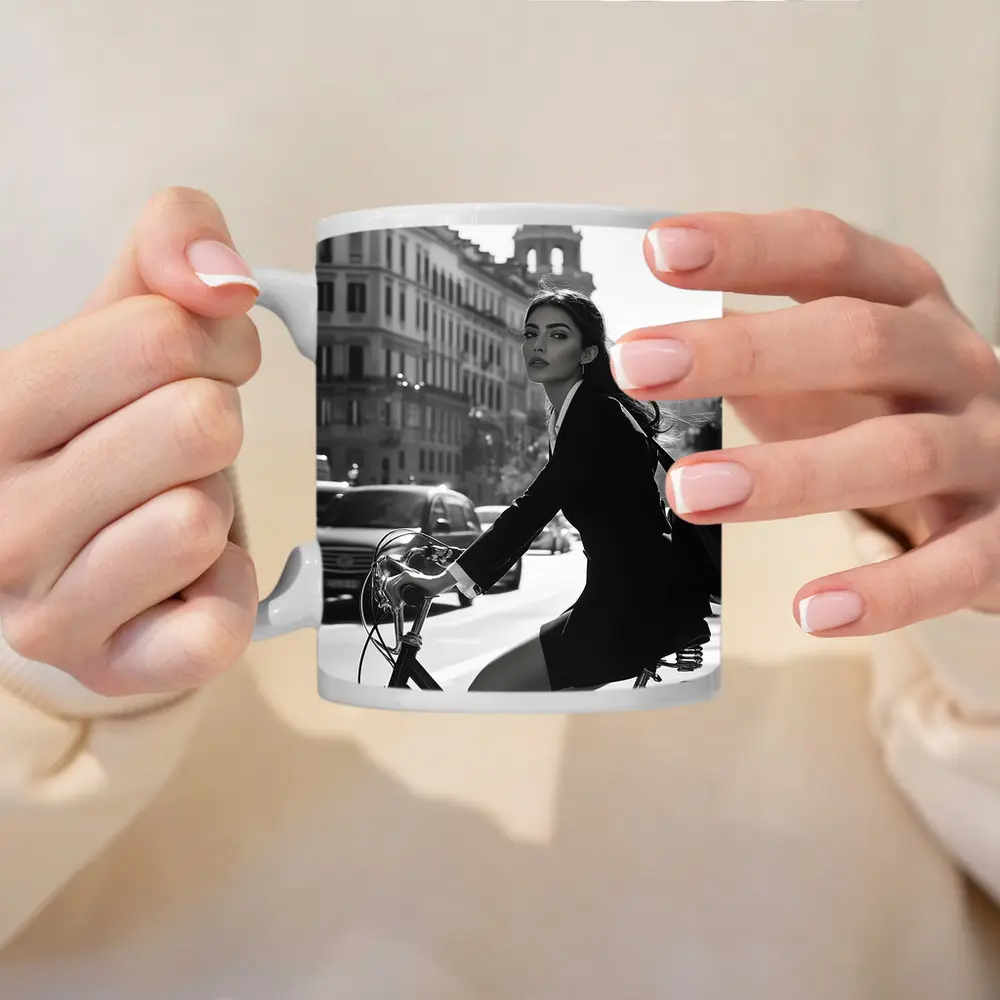 Elegant Woman Cycling Black and White City – Mugs