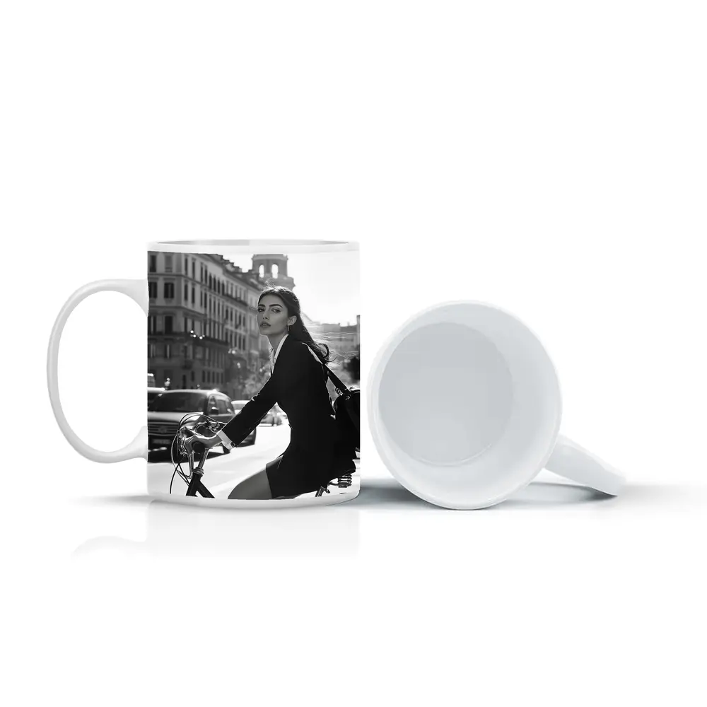 Elegant Woman Cycling Black and White City – Mugs