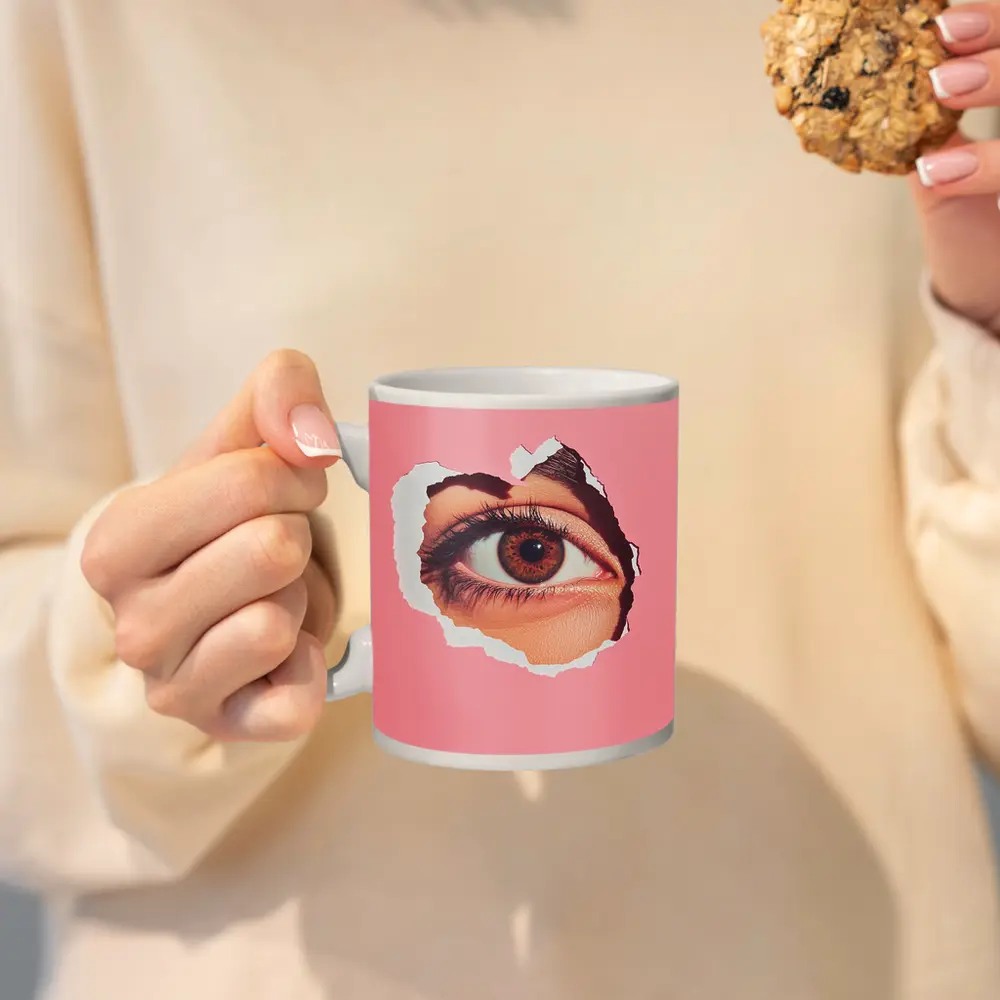 Brown Eye Peering Through Torn Pink Paper – Mugs