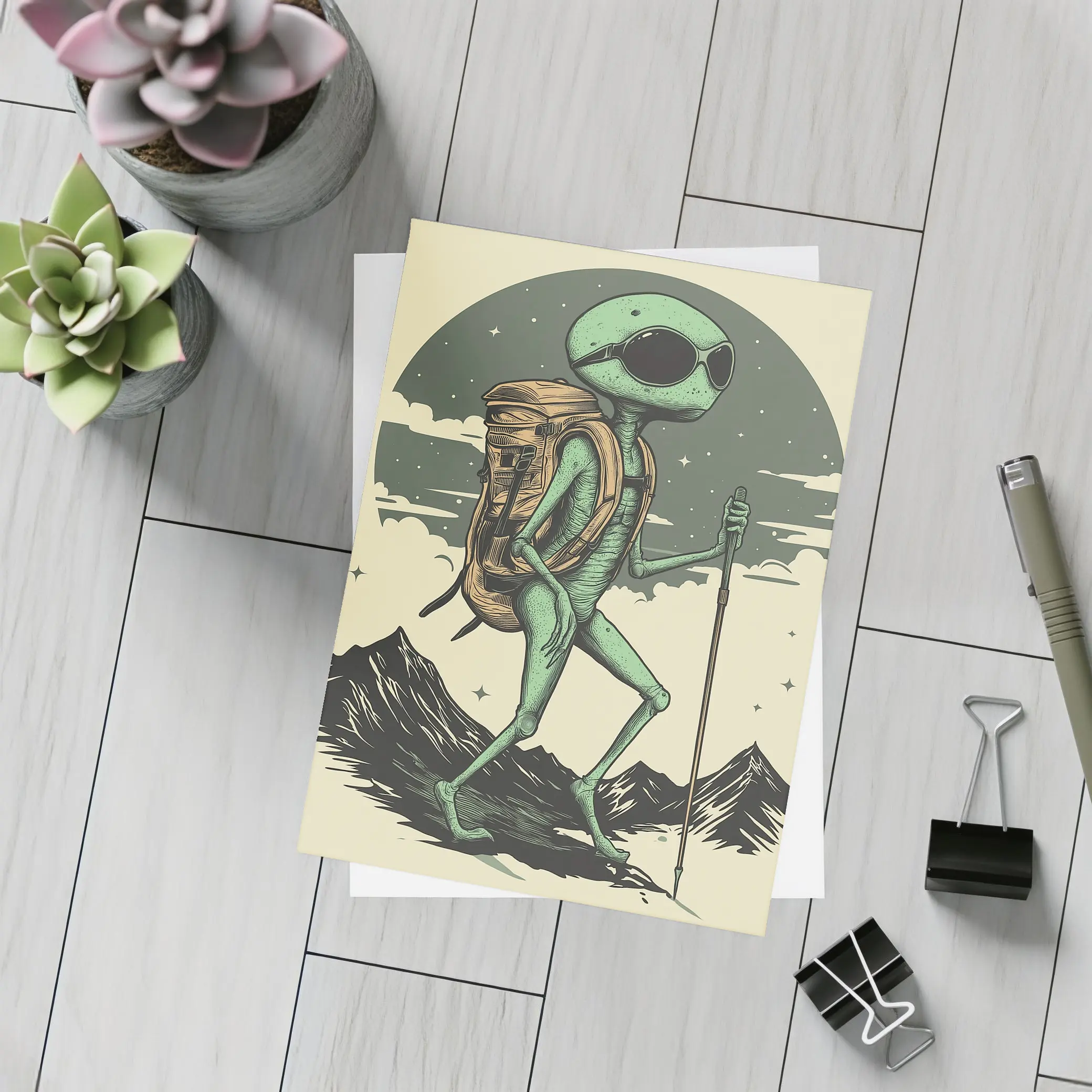 Alien Hiker Backpacking Through Mountain Landscape – Postcards