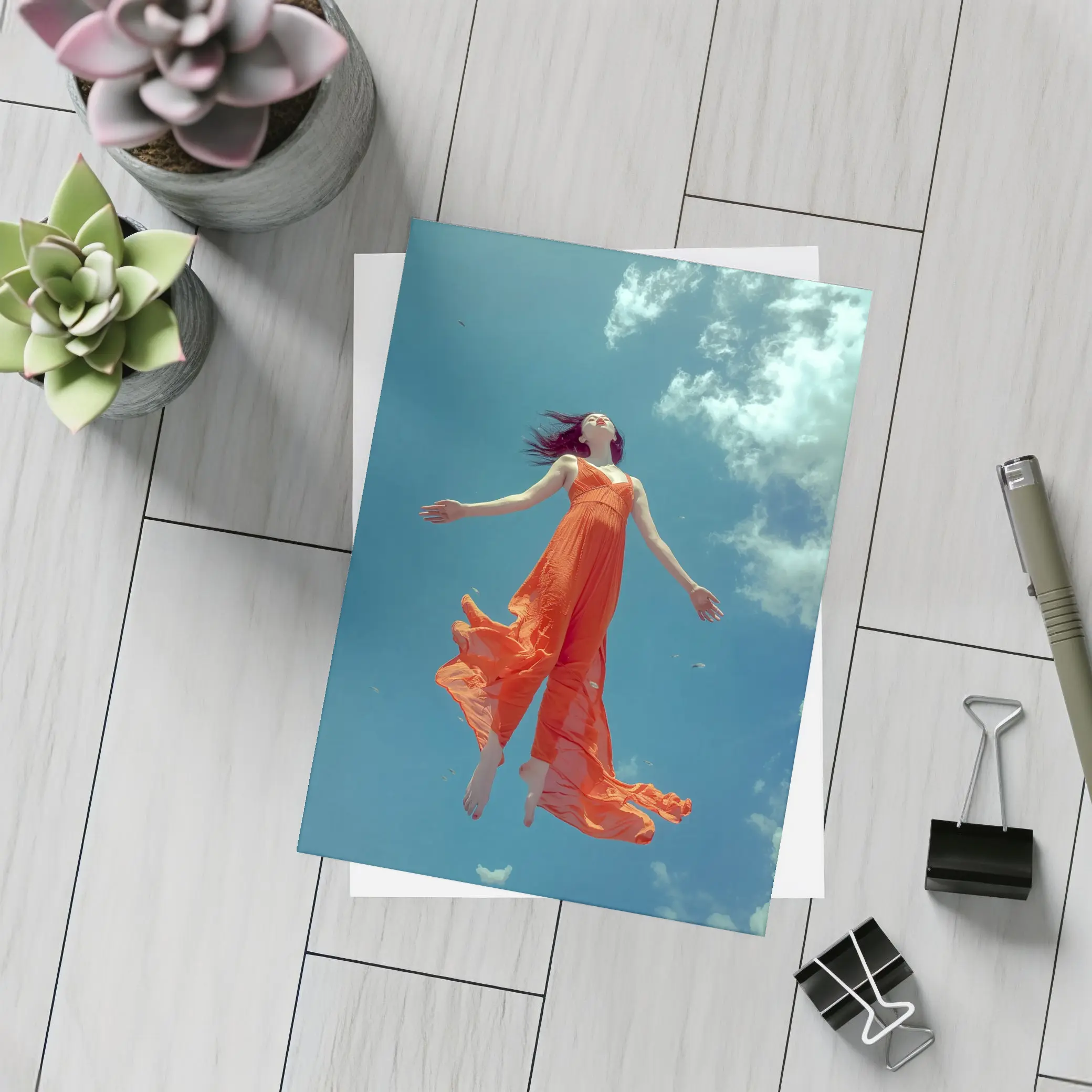 Woman Floating in Blue Sky Orange Dress – Postcards