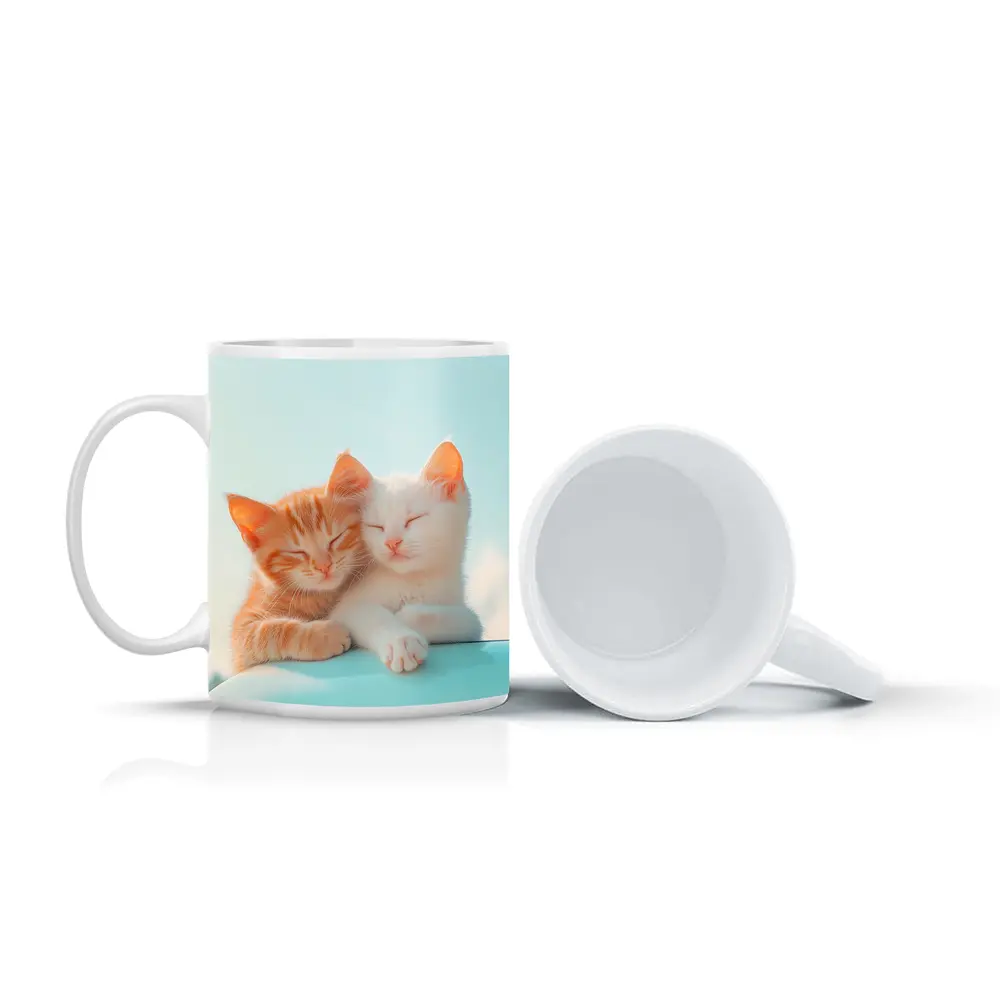 Two Kittens Cuddling Against Light Blue Sky – Mugs