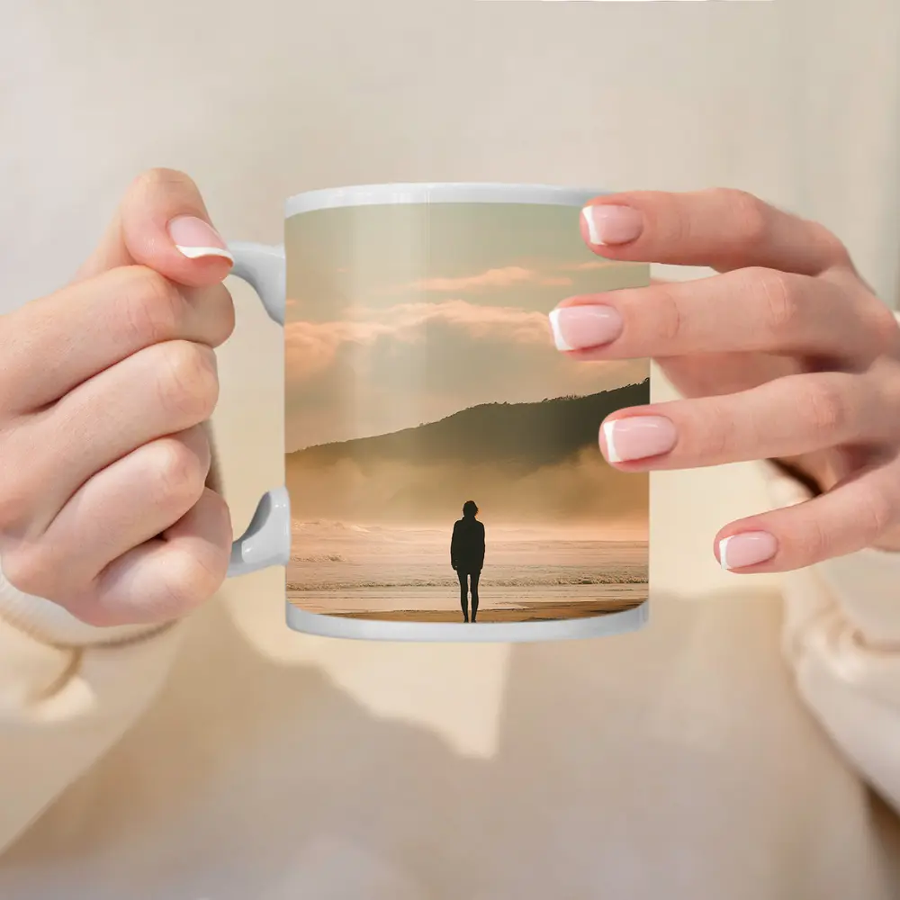 Lone Woman Standing On Misty Beach Shore – Mugs
