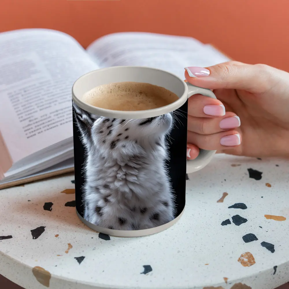 Snow Leopard Cub Looking Up Dark Background – Mugs