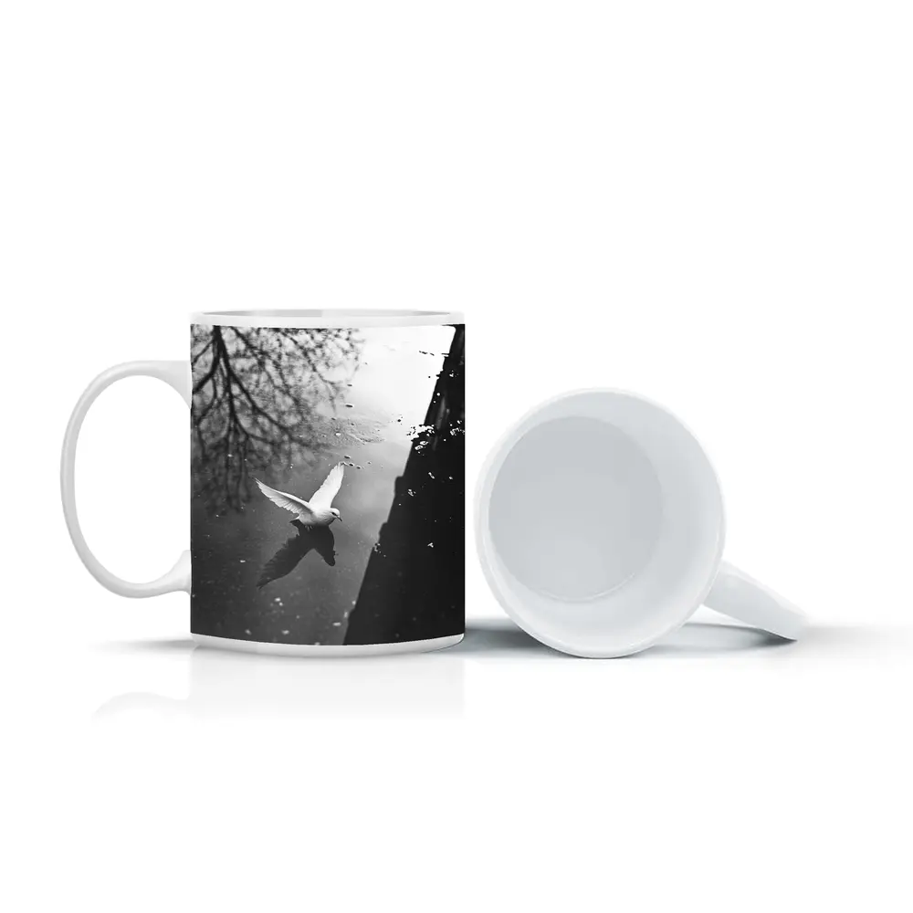 White Dove Flying Over Dark Water – Mugs