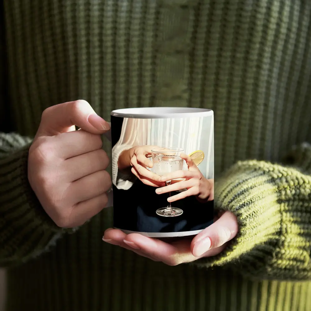 Hands Holding Cocktail Glass With Lemon – Mugs