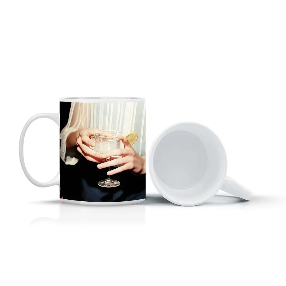 Hands Holding Cocktail Glass With Lemon – Mugs