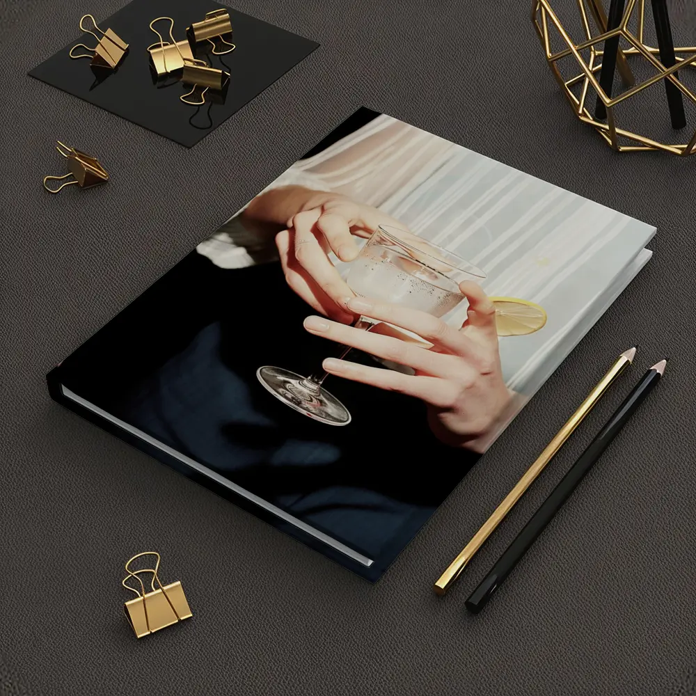 Hands Holding Cocktail Glass With Lemon – Notebooks