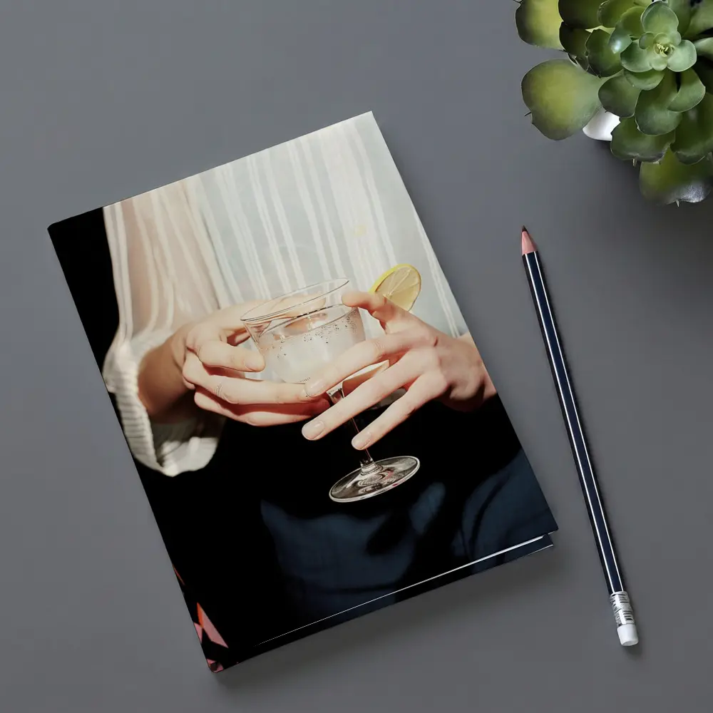 Hands Holding Cocktail Glass With Lemon – Notebooks