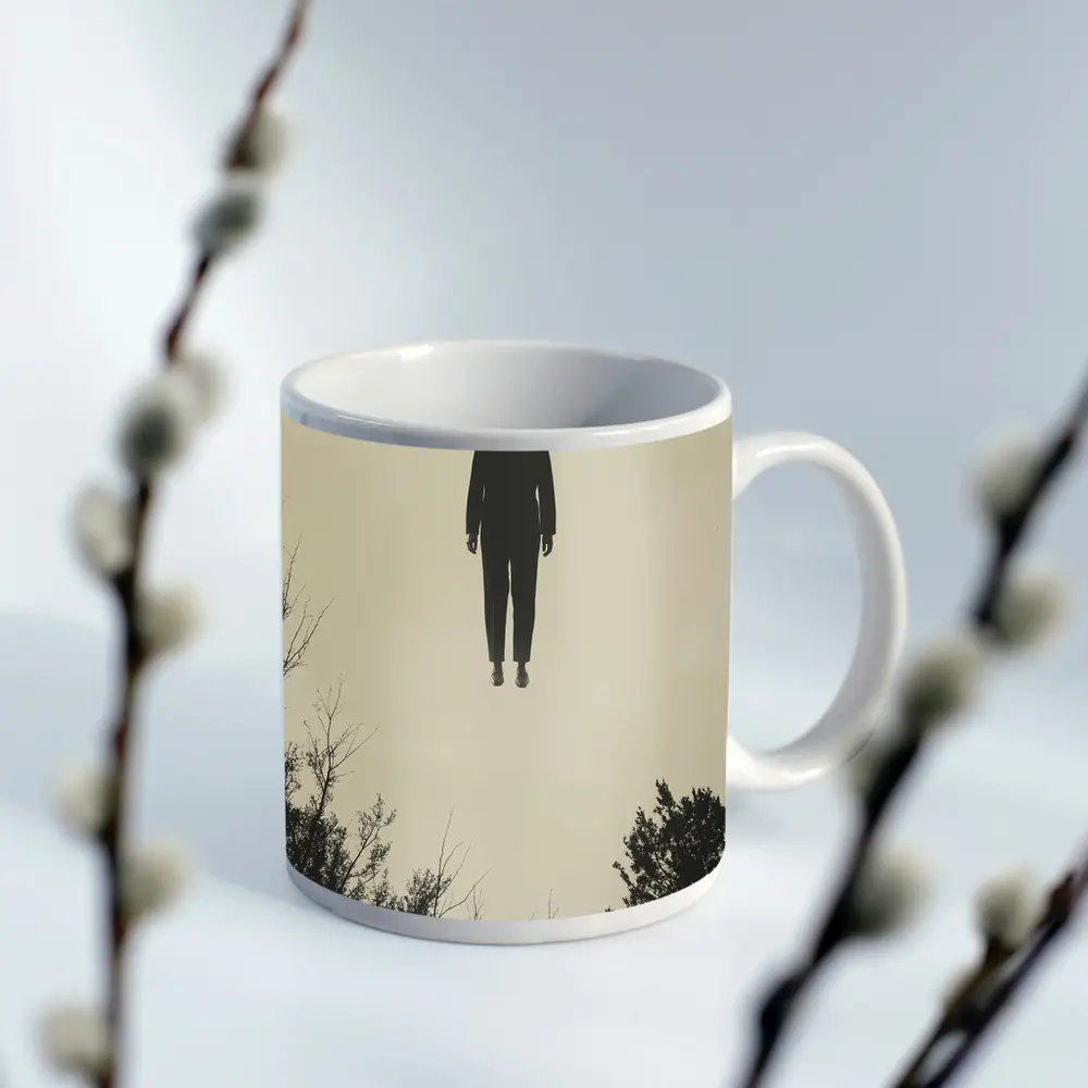 Floating Man Silhouette Above Dark Trees – Mugs