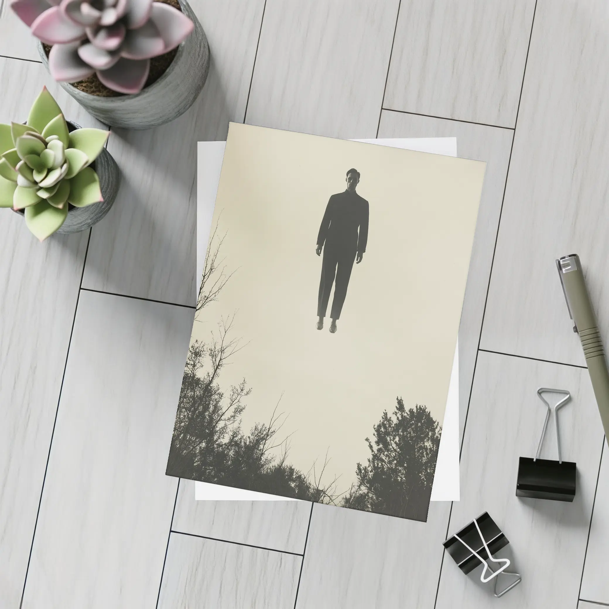 Floating Man Silhouette Above Dark Trees – Postcards