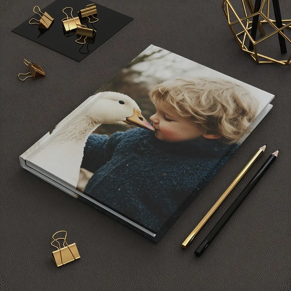 Child Kissing White Goose Outdoors – Notebooks