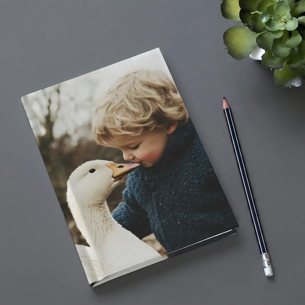 Child Kissing White Goose Outdoors – Notebooks