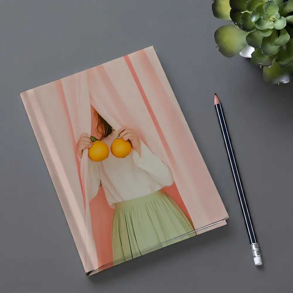 Woman Holding Oranges Pink Curtain Background – Notebooks
