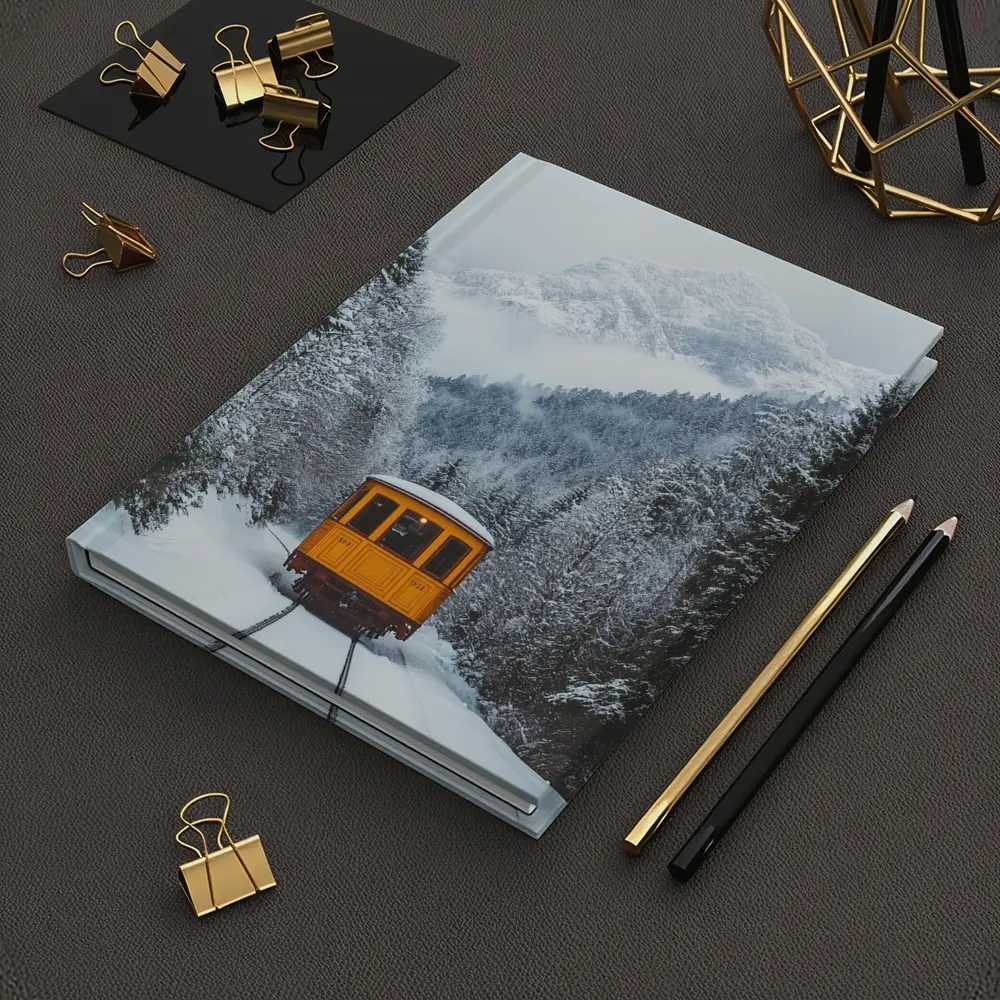 Yellow Train Passing Through Snowy Mountain Forest – Notebooks