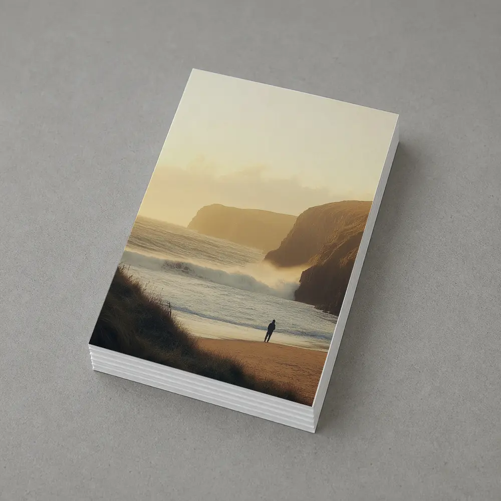 Lone Figure Standing on Golden Coastal Beach – Postcards