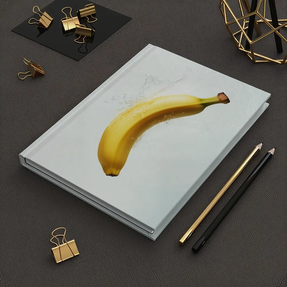 Banana Splashing Through Clear Water Background – Notebooks