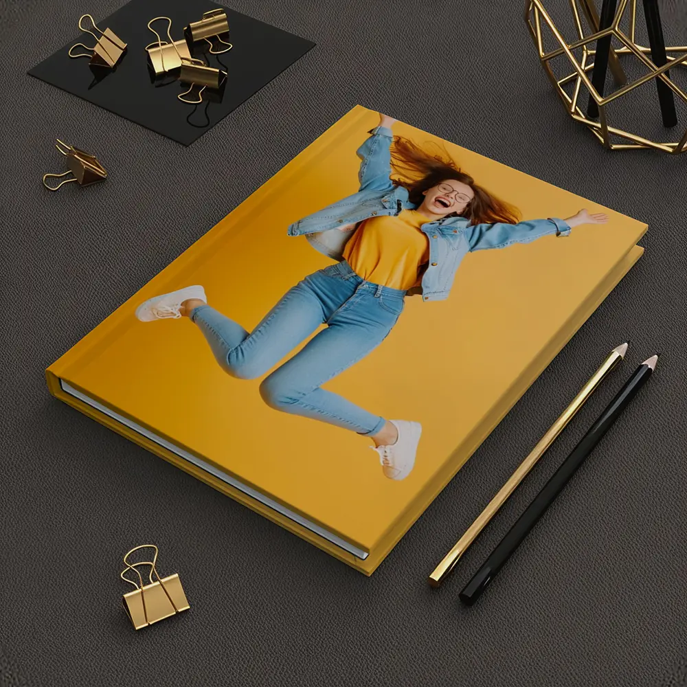 Happy Girl Jumping On Yellow Background – Notebooks