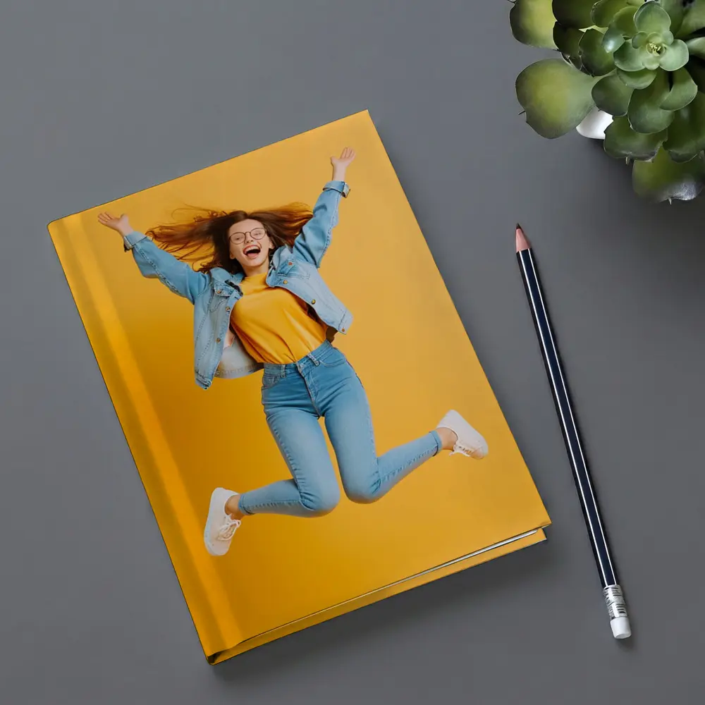 Happy Girl Jumping On Yellow Background – Notebooks