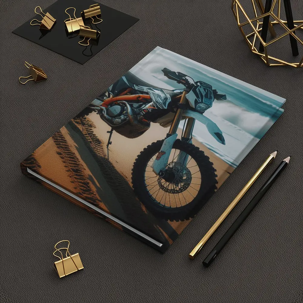 KTM Dirt Bike Parked on Sandy Beach – Notebooks