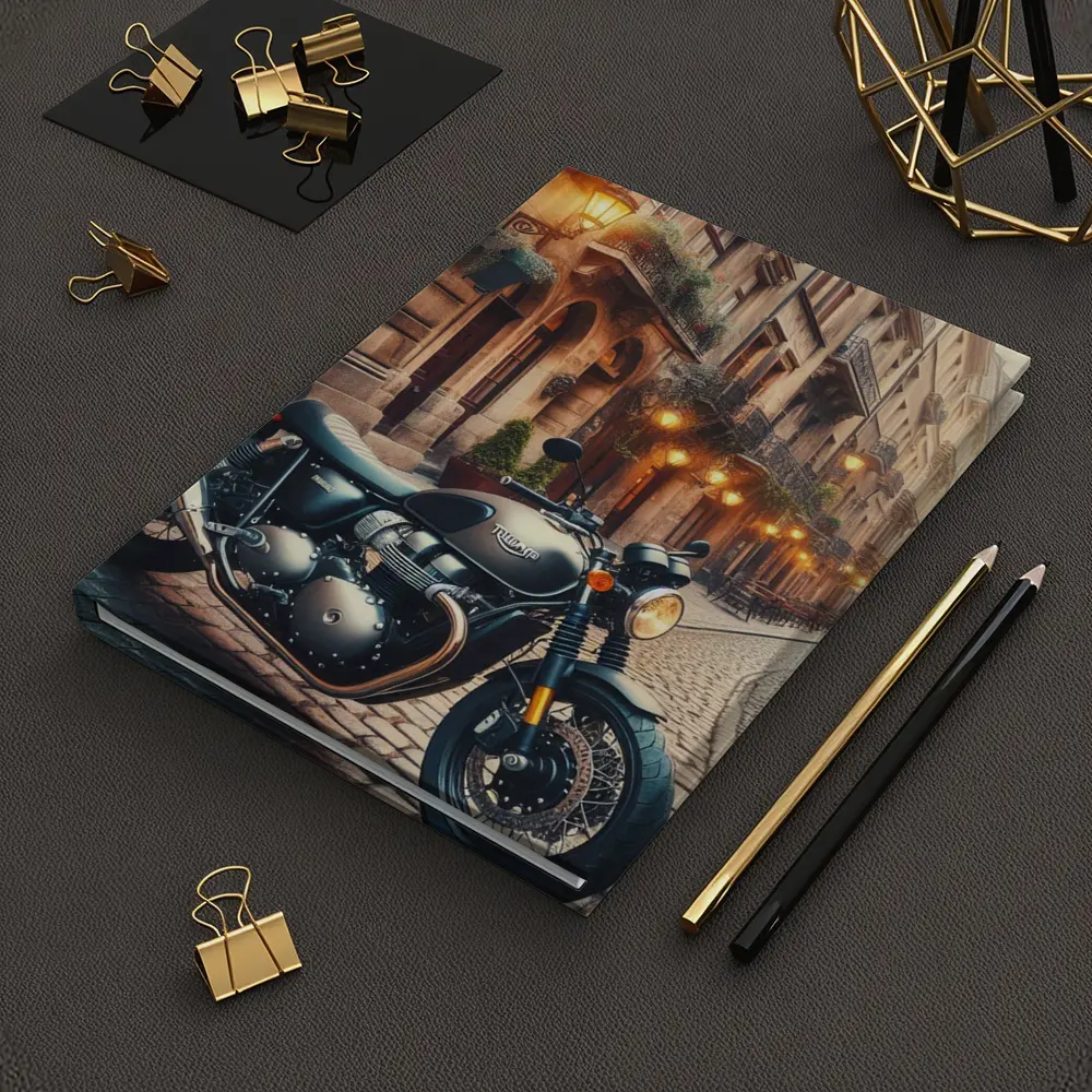 Triumph Motorcycle Parked on Cobblestone Street – Notebooks