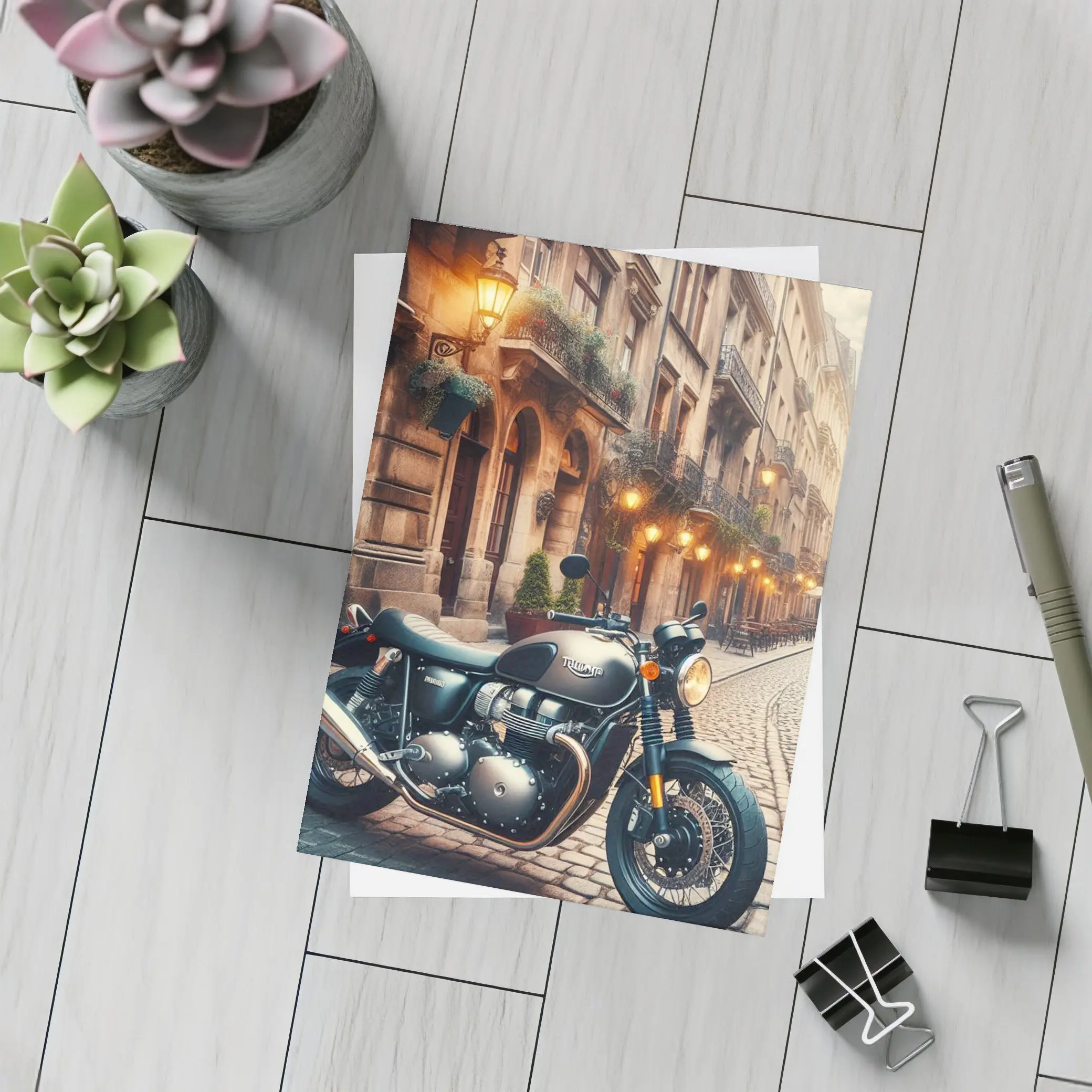 Triumph Motorcycle Parked on Cobblestone Street – Postcards