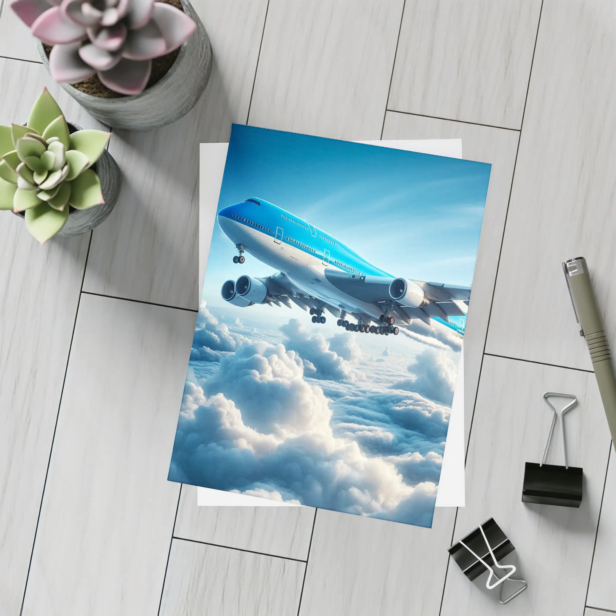 Blue Jumbo Jet Flying Above Clouds – Postcards