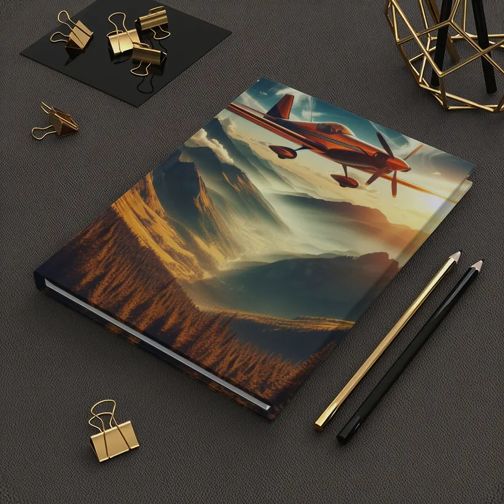 Red Propeller Plane Flying Over Mountain Valley – Notebooks