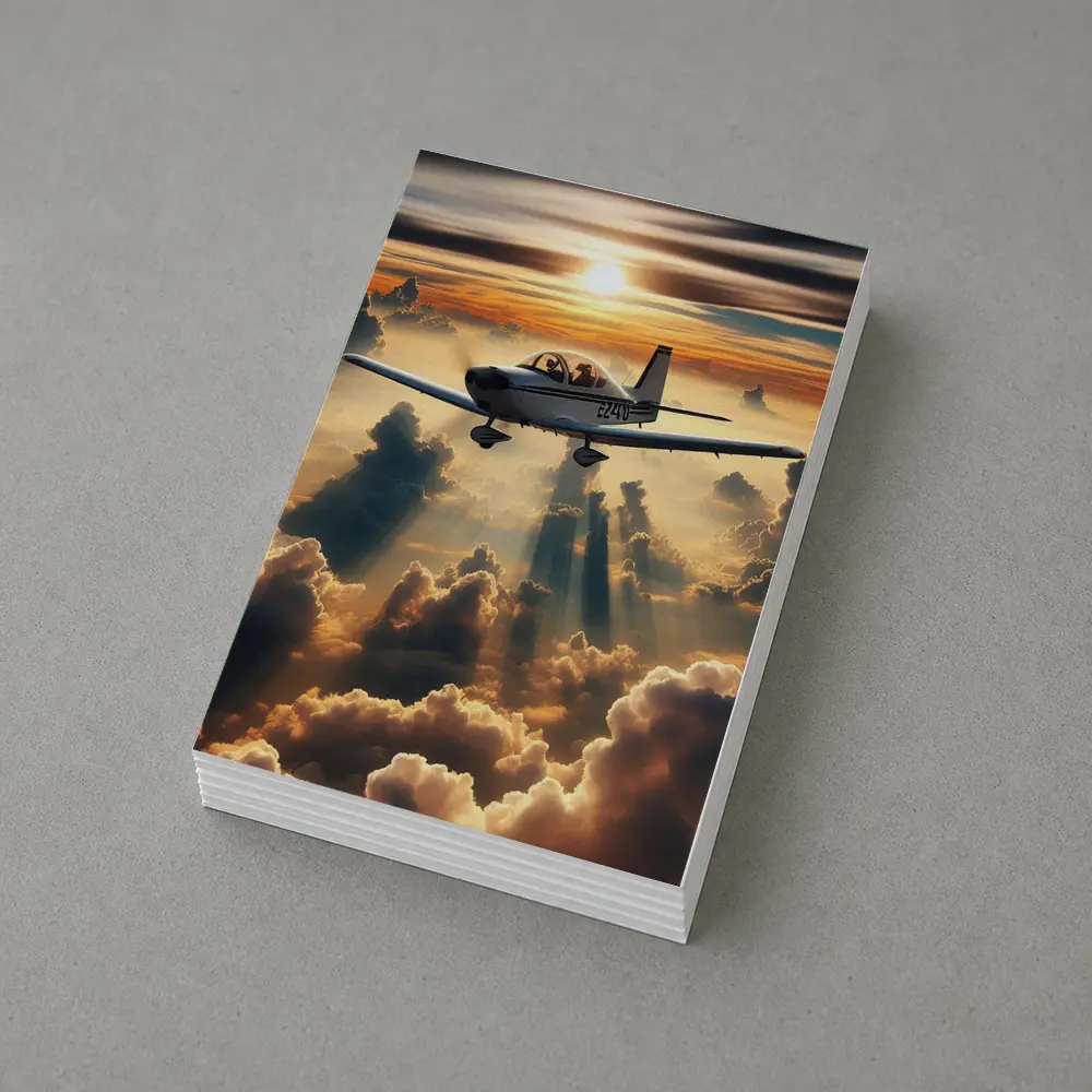 Small Airplane Flying Above Sunset Clouds – Postcards