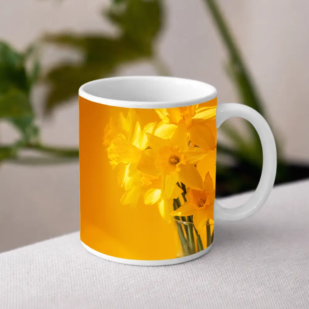 Yellow Daffodils In Glass Vase Golden Background – Mugs