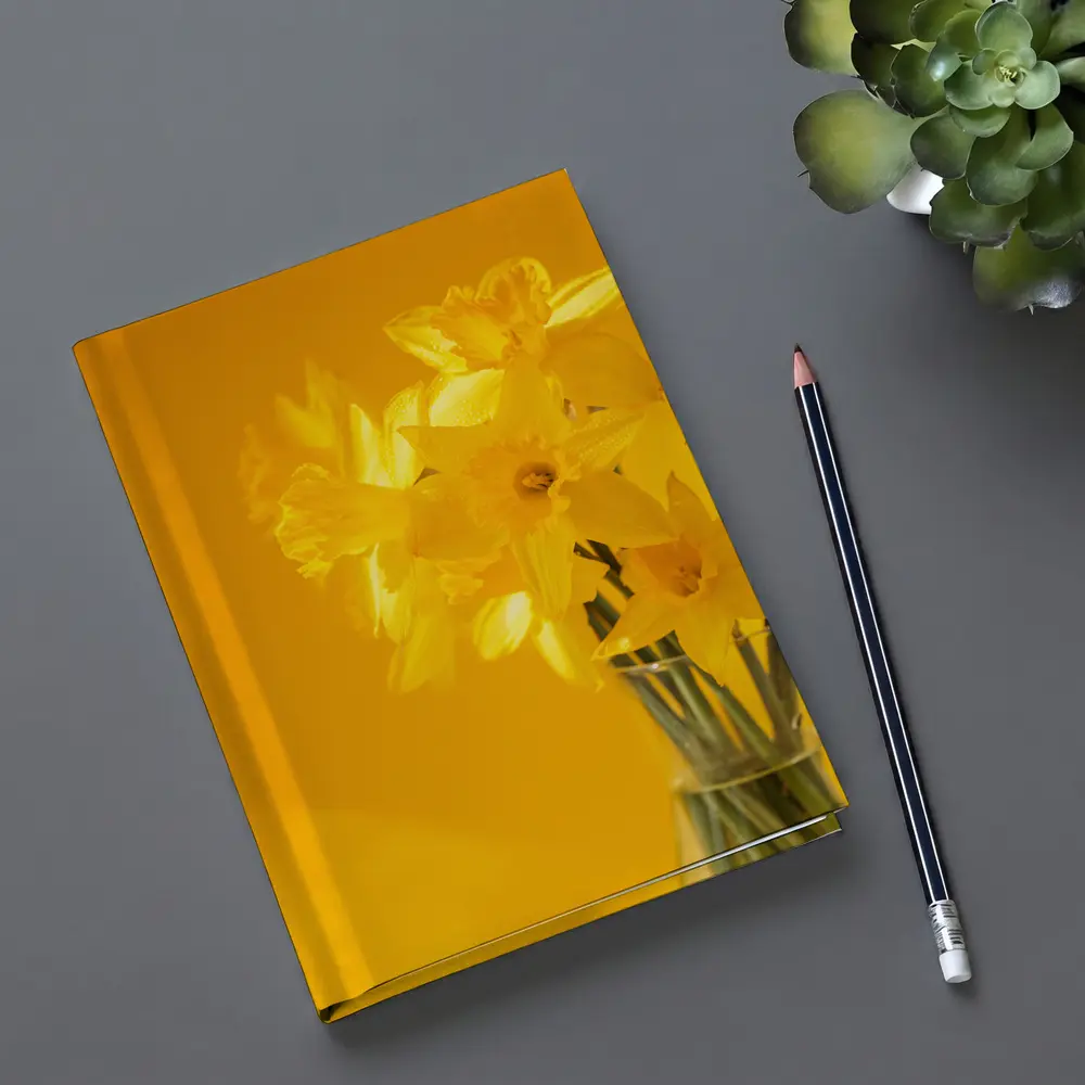 Yellow Daffodils In Glass Vase Golden Background – Notebooks