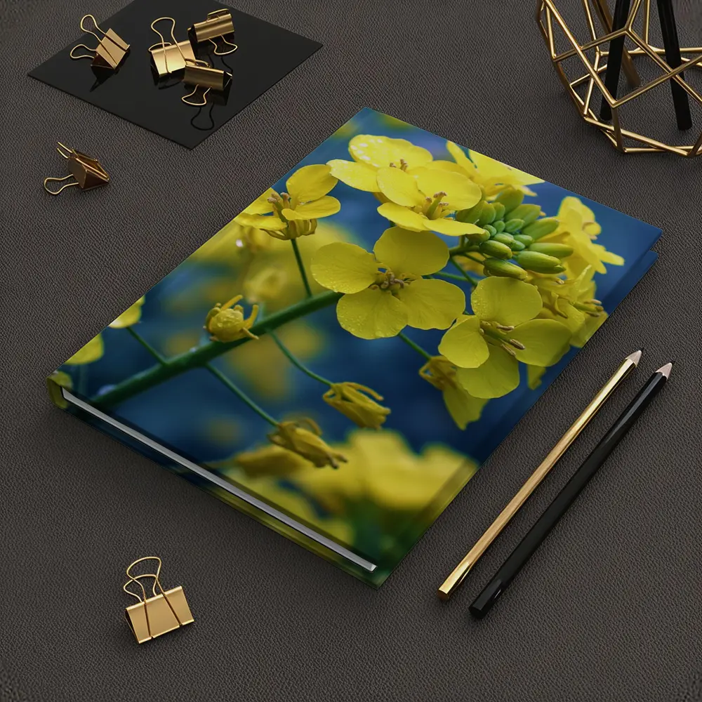 Yellow Rapeseed Flowers Against Blue Background – Notebooks