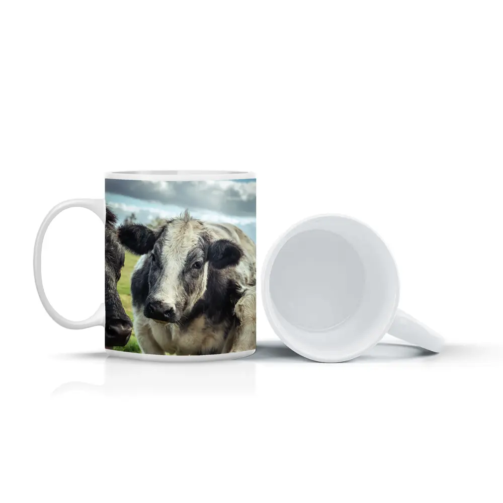 Black White Cow Close Up Green Field – Mugs