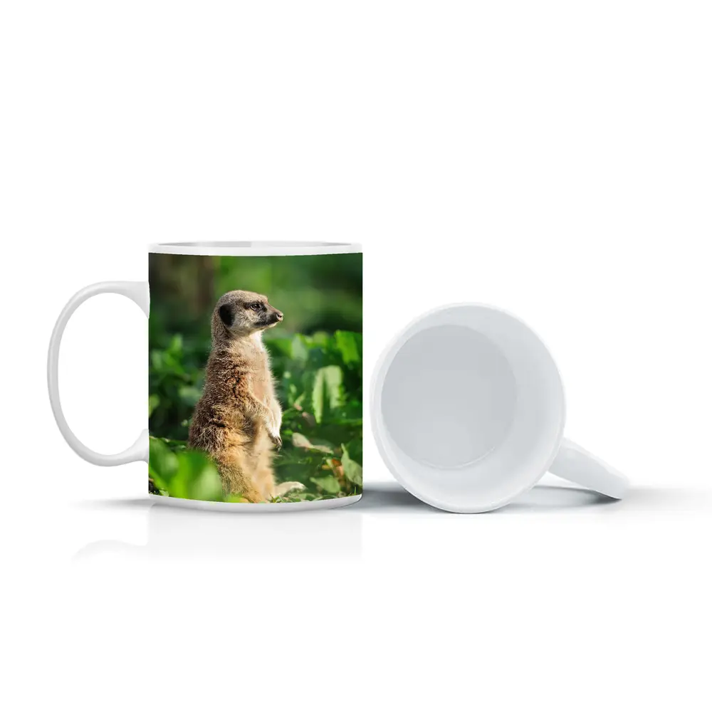 Meerkat Standing Alert In Green Foliage – Mugs