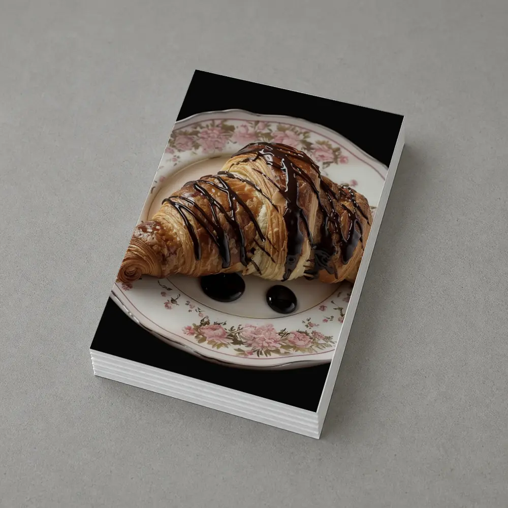 Chocolate Drizzled Croissant On Floral Plate – Postcards