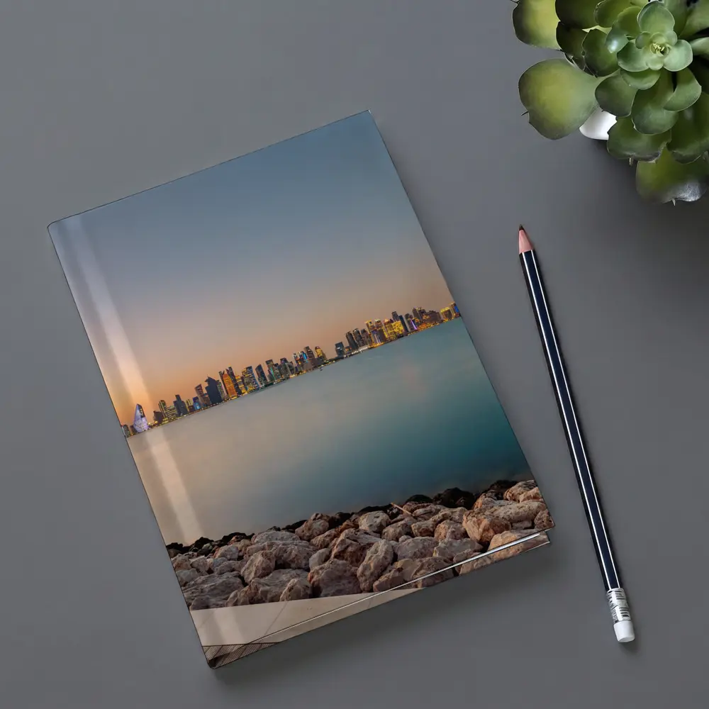 Doha Qatar Skyline at Sunset Over Water – Notebooks