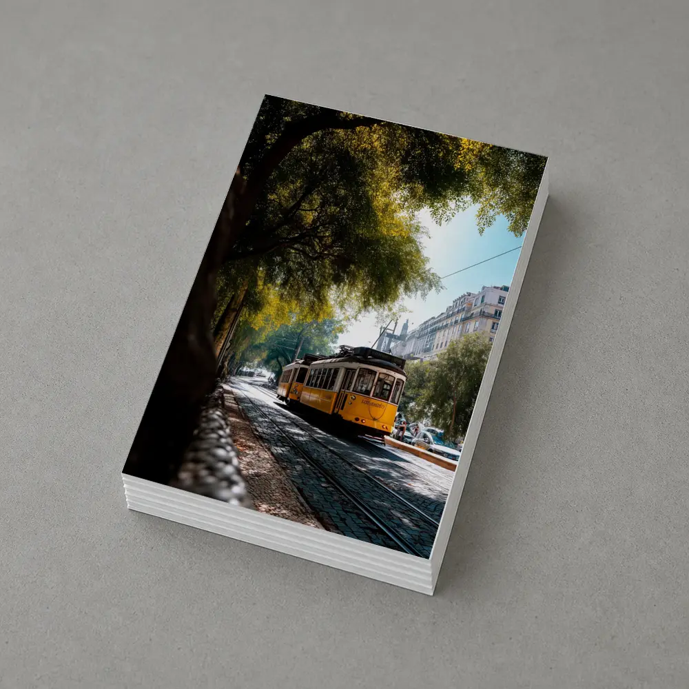 Yellow Tram on Cobblestone Lisbon Street – Postcards