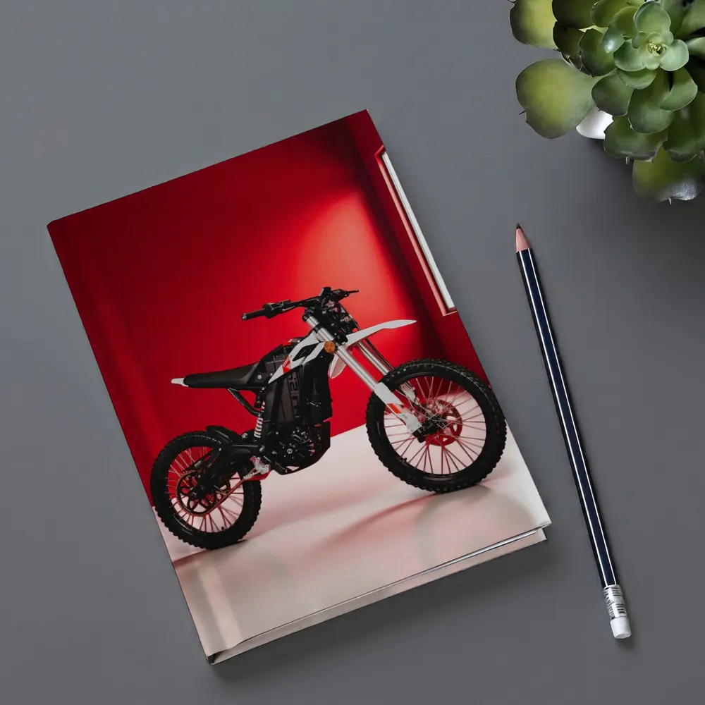 Electric Dirt Bike Against Bold Red Wall – Notebooks