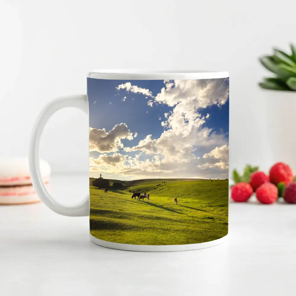 Cows Grazing Green Rolling Hills Sunny Sky – Mugs