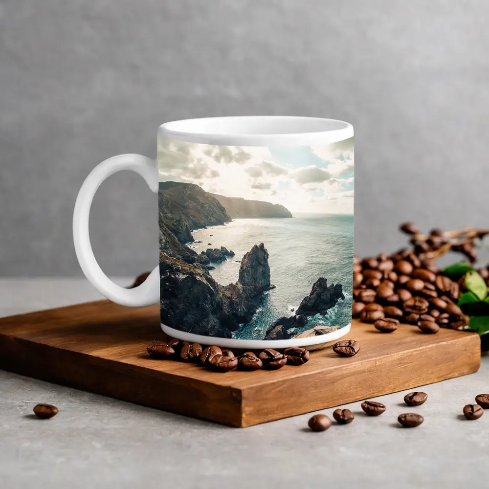 Rocky Coastal Cliffs Over Blue Ocean – Mugs
