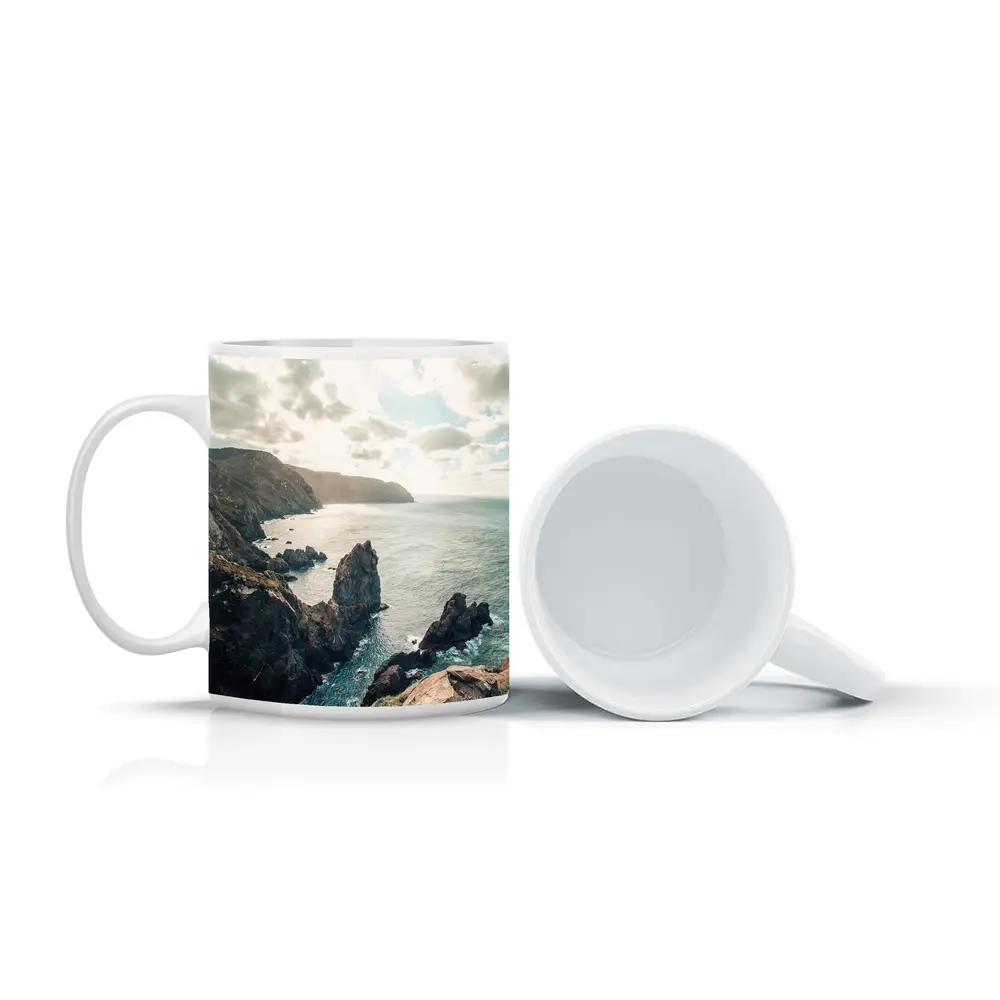 Rocky Coastal Cliffs Over Blue Ocean – Mugs