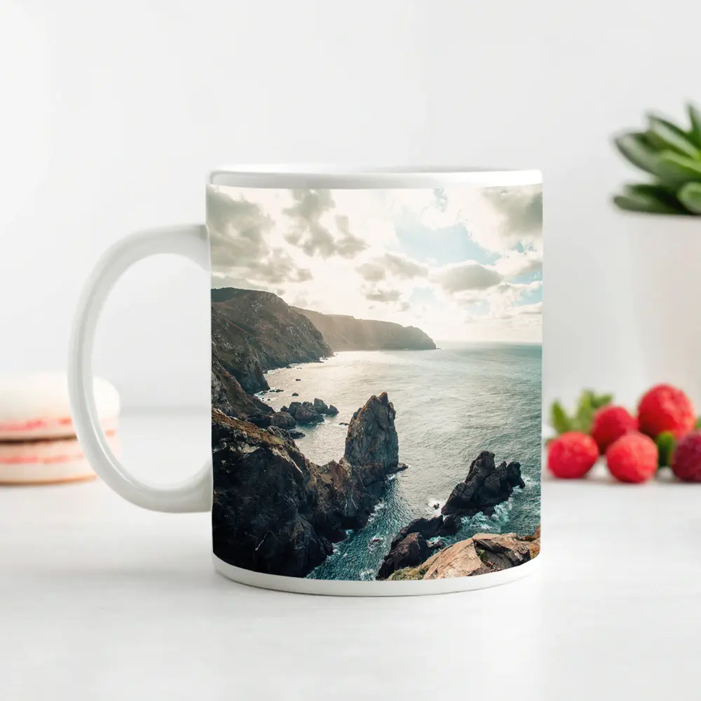 Rocky Coastal Cliffs Over Blue Ocean – Mugs