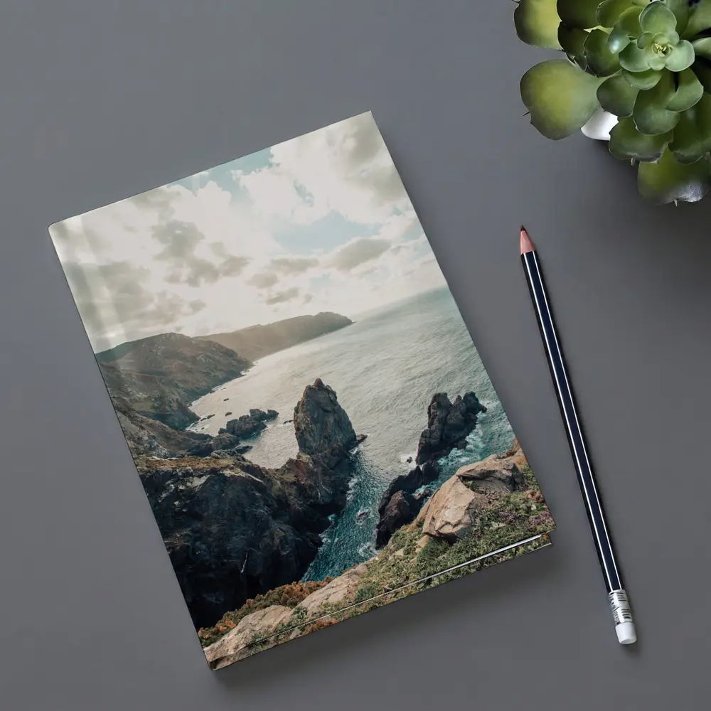 Rocky Coastal Cliffs Over Blue Ocean – Notebooks