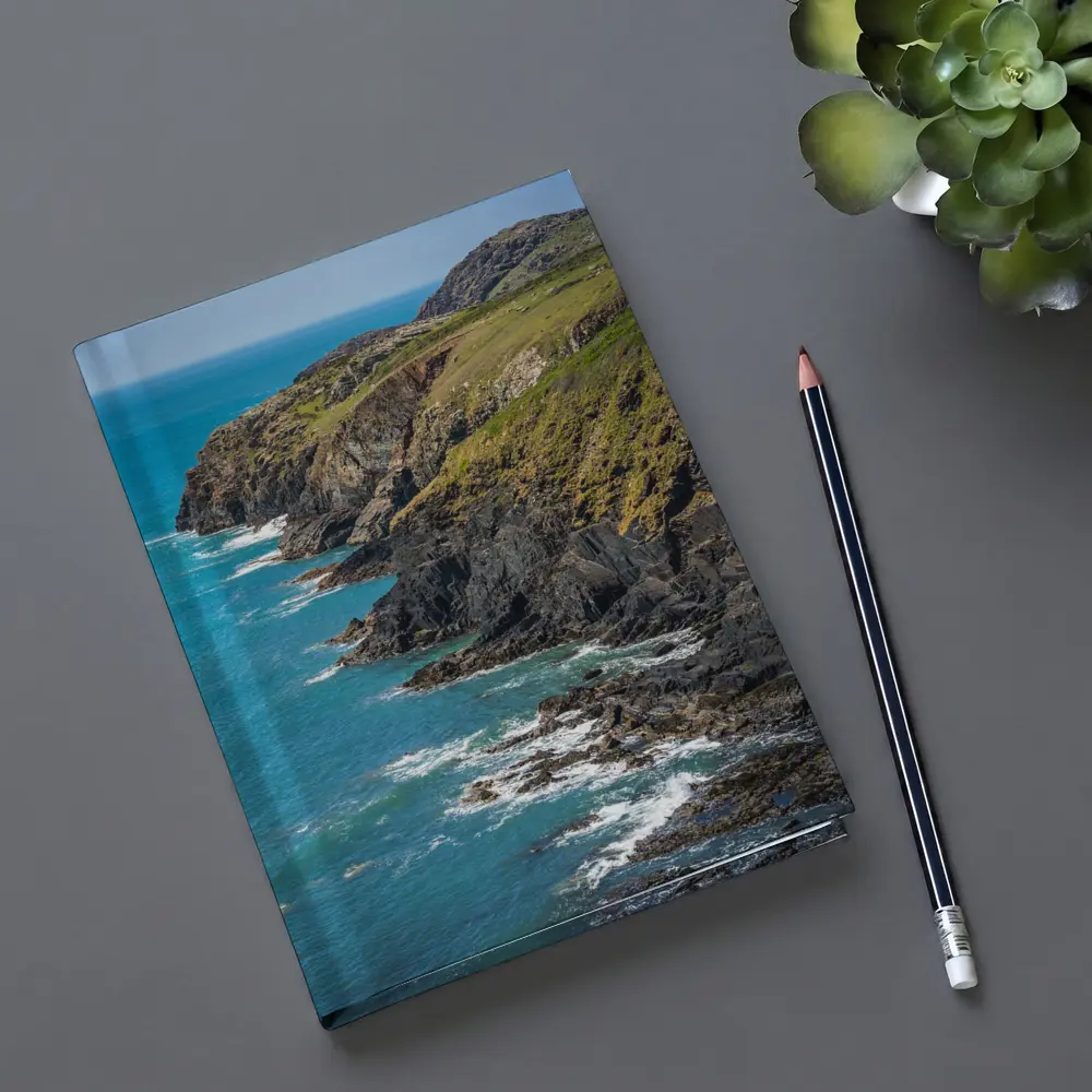 Rocky Coastal Cliffs Above Turquoise Ocean Waves – Notebooks