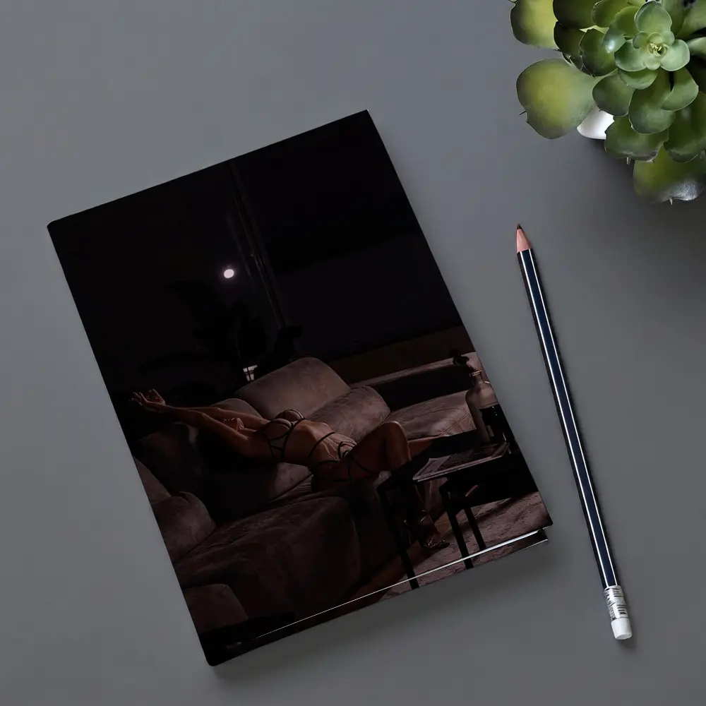 Woman in Lingerie Relaxing on Dark Sofa – Notebooks
