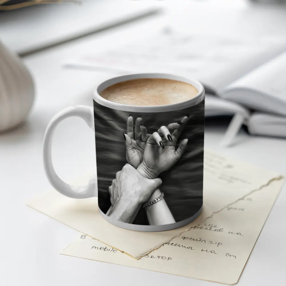 Black and White Hands Grasping Bed Sheet – Mugs