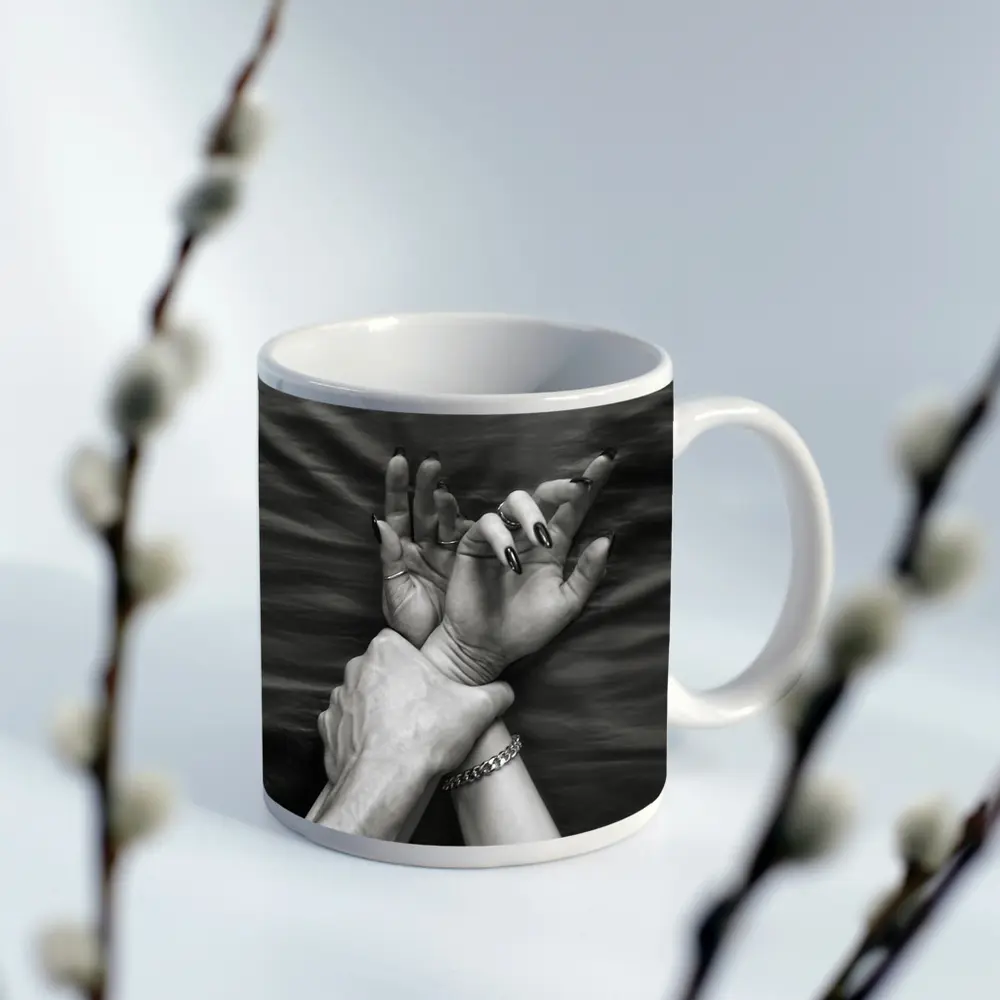 Black and White Hands Grasping Bed Sheet – Mugs