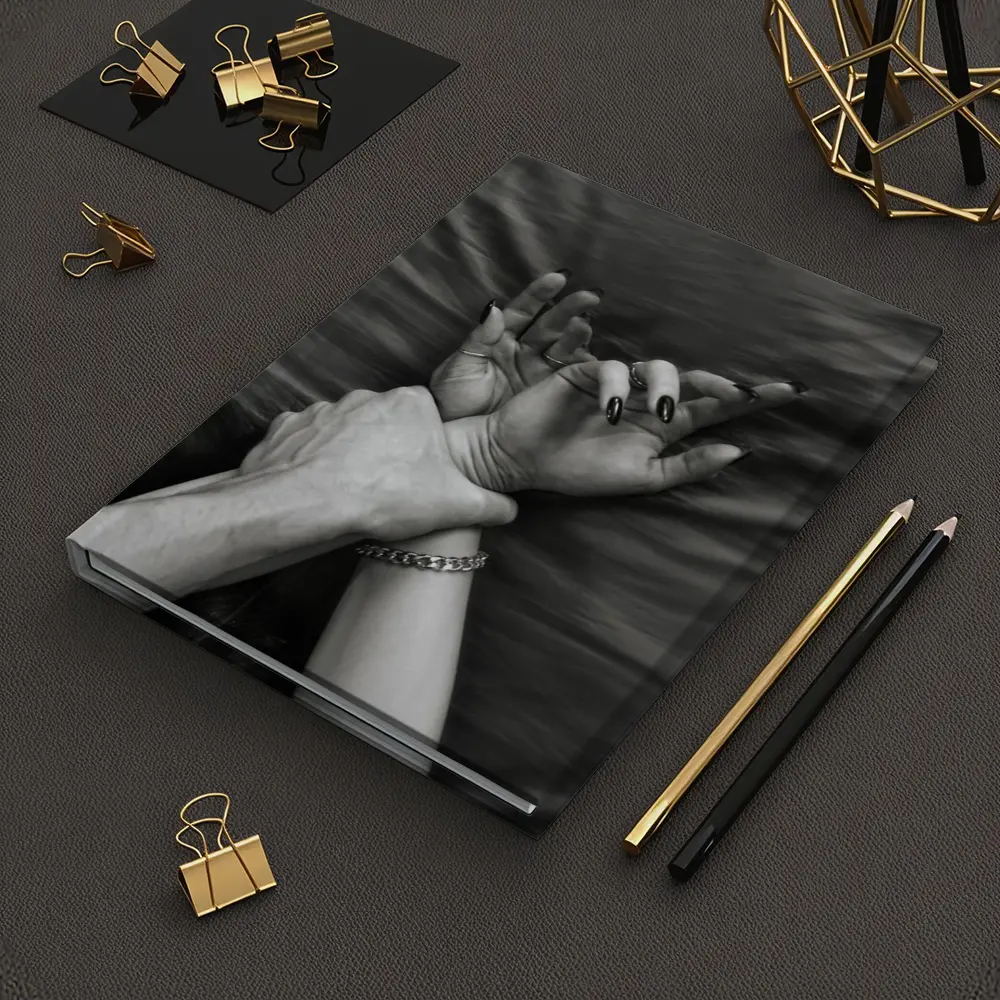 Black and White Hands Grasping Bed Sheet – Notebooks