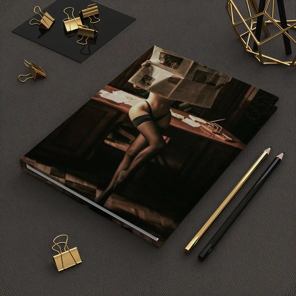 Sexy Woman Reading Newspaper at Office Desk – Notebooks